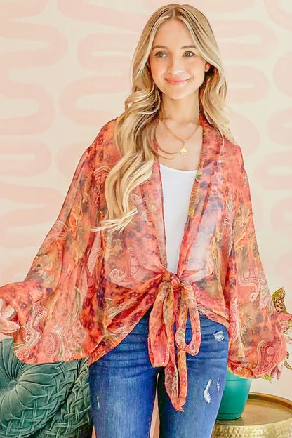 Rust-colored oversized print top with front tie knot from Trendsi, featuring a relaxed fit and trendy design.