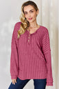 Rust-colored Trendsi Basic Bae ribbed long sleeve T-shirt with half-button front, full size, fitted and casual style.