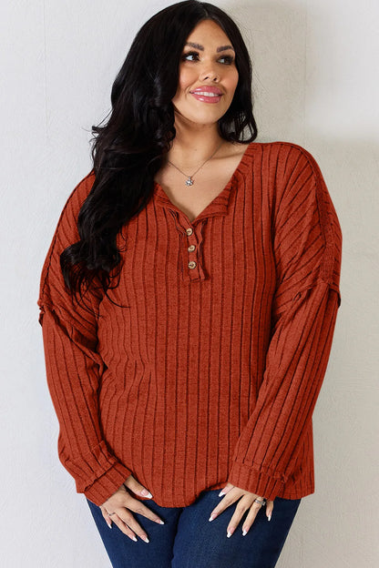 Rust-colored Trendsi Basic Bae full-size ribbed half-button long sleeve T-shirt, showing the ribbed texture and half-button detail.