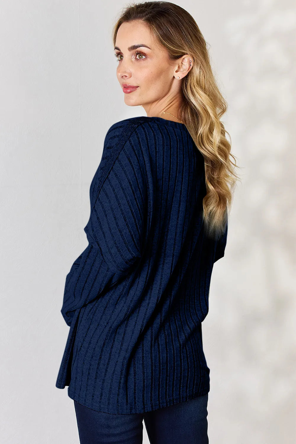 Rust-colored Basic Bae ribbed long sleeve T-shirt with half-button detail, full size, by Trendsi, featuring a fitted ribbed design.
