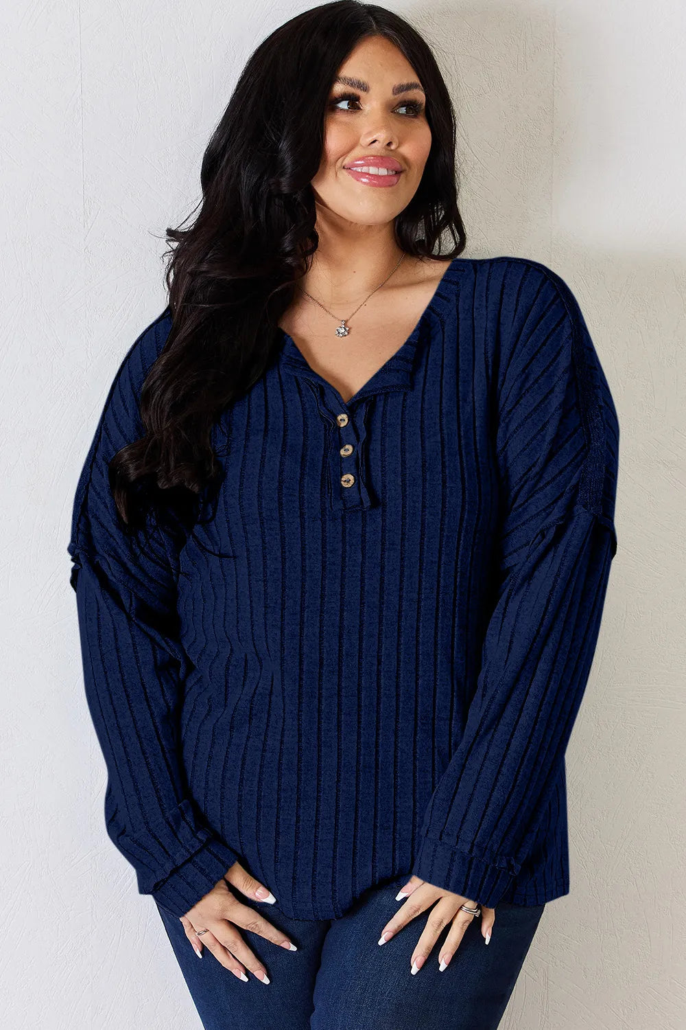 Rust-colored Trendsi Basic Bae full-size ribbed long sleeve T-shirt with half button front, showcasing its fitted ribbed fabric.