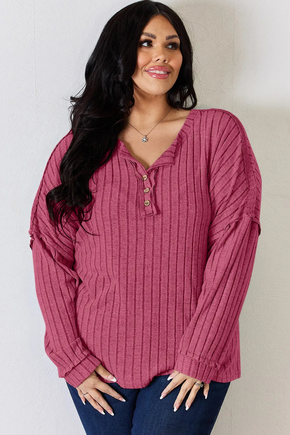 Rust-colored Trendsi Basic Bae full-size ribbed long sleeve T-shirt with half button front, showcasing a fitted, casual style.