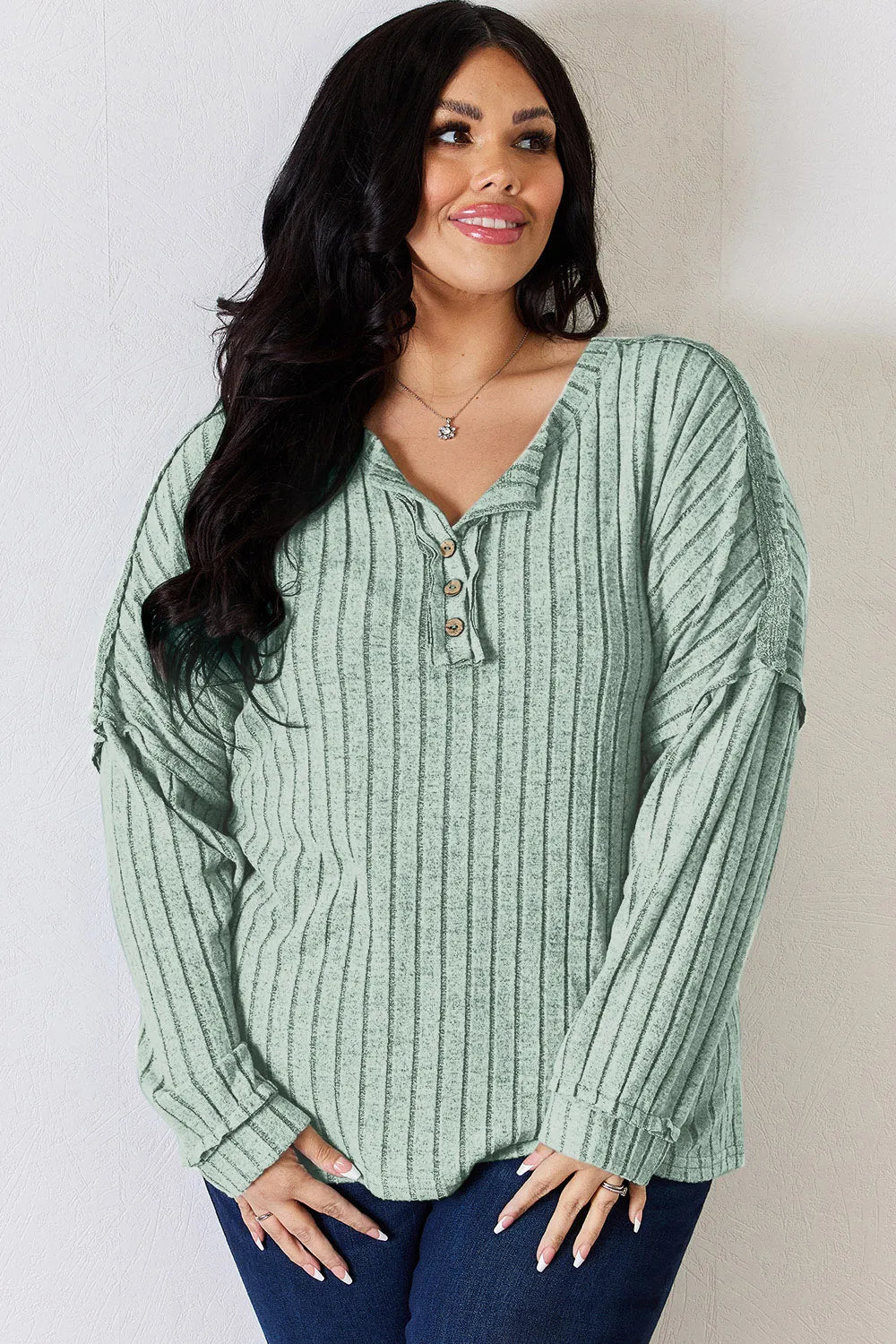Rust-colored Trendsi Basic Bae full-size ribbed long sleeve T-shirt with half-button front, casual and comfortable fit.