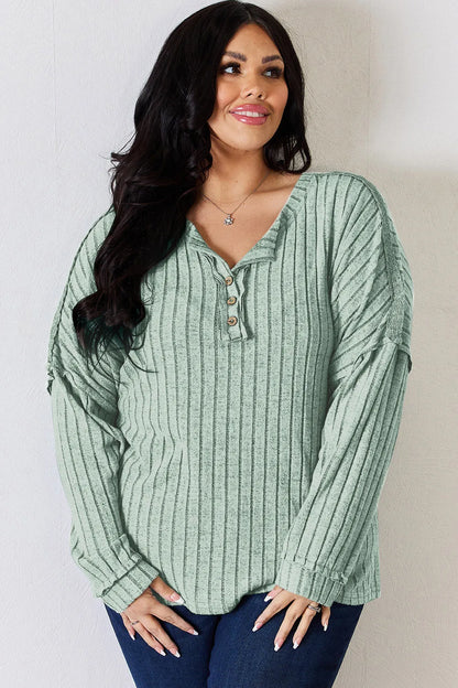 Rust-colored Trendsi Basic Bae full-size ribbed long sleeve T-shirt with half-button front, casual and comfortable fit.
