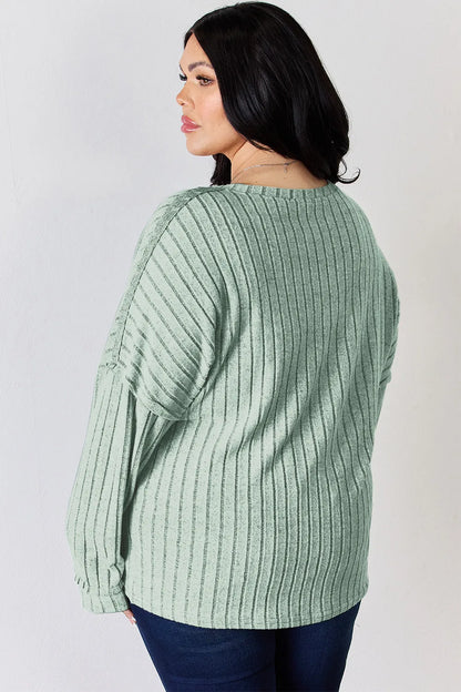 Rust-colored Basic Bae full-size ribbed long sleeve T-shirt with half-button front, by Trendsi, shown flat on white background.