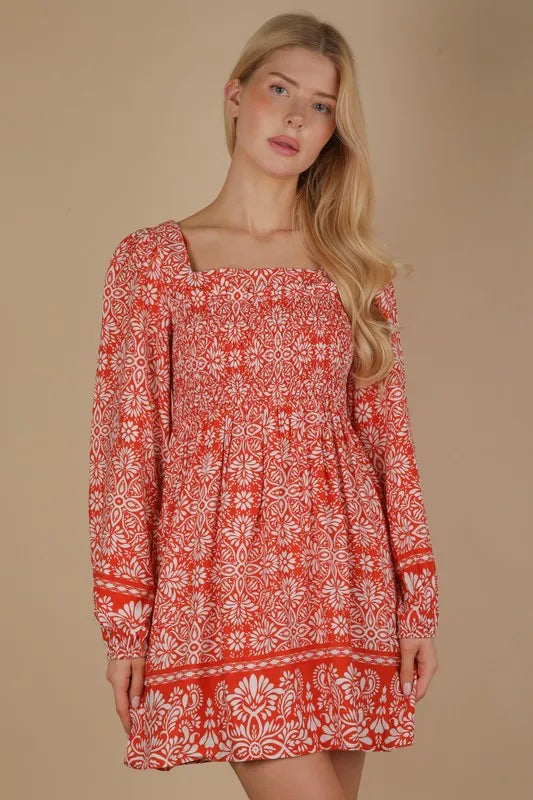 Rust-colored Very J printed boho mini dress with smocked chest and short sleeves, featuring a relaxed, stylish fit.