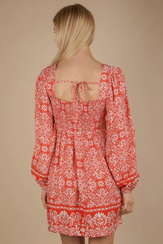 Rust-colored Very J printed smocked chest boho mini dress with a relaxed fit, featuring a bohemian style and floral pattern.