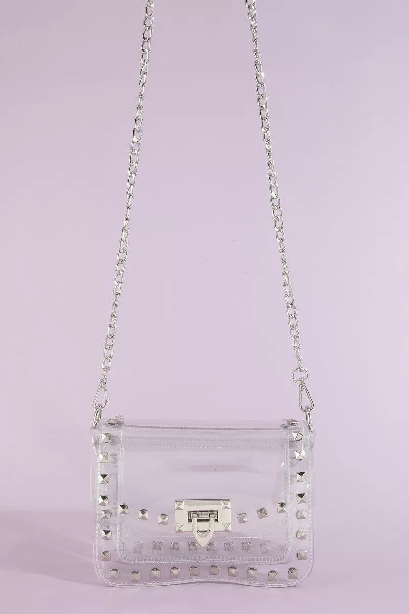 Clear studded crossbody stadium bag with chain strap by Trendsi, featuring a transparent design and metal stud accents.