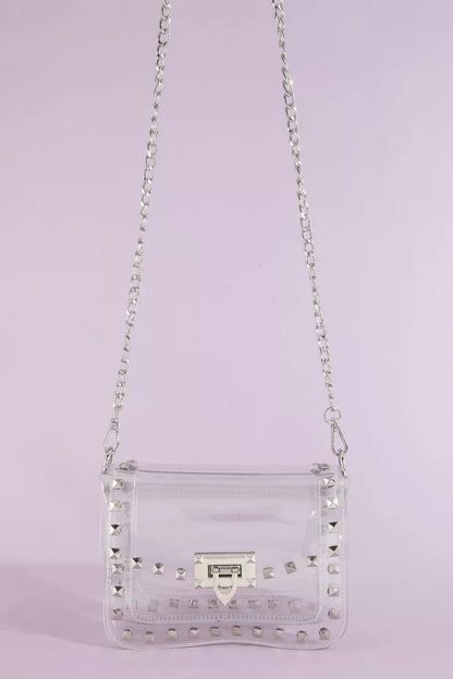 Clear studded crossbody stadium bag with chain strap by Trendsi, featuring a transparent design and metal stud accents.