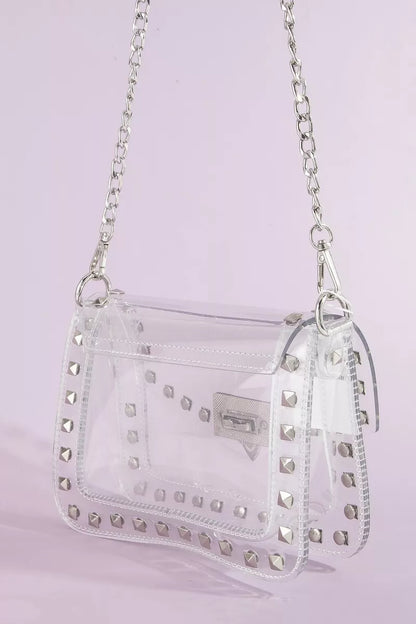 Clear stadium crossbody bag with studded design and chain strap by Trendsi, perfect for stylish events and concerts.