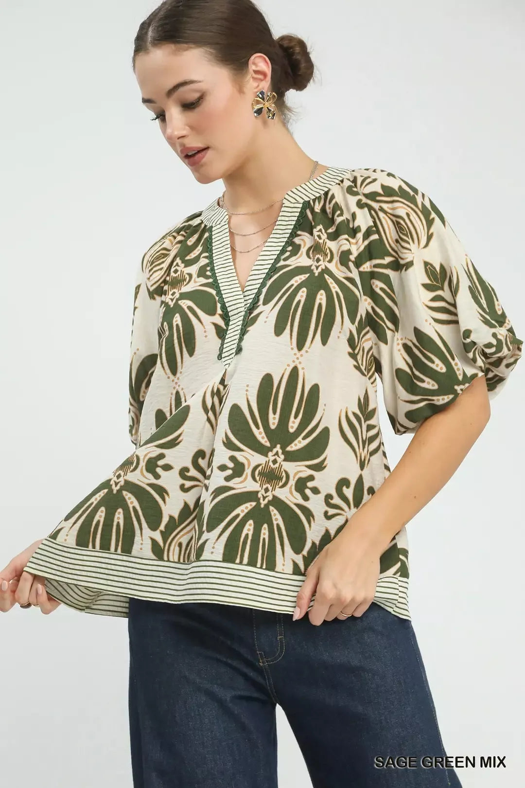 Sage green Umgee printed puff sleeve top with contrast trim, showcasing a stylish mix pattern and feminine sleeve design.