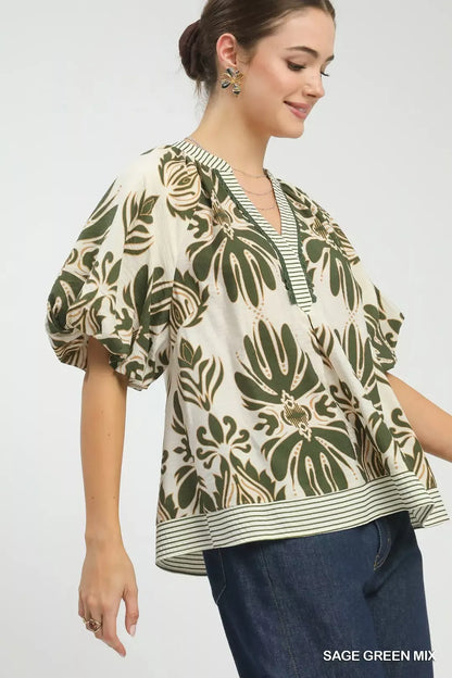 Sage green Umgee printed puff sleeve top with contrast trim, featuring a stylish mix pattern and feminine design.