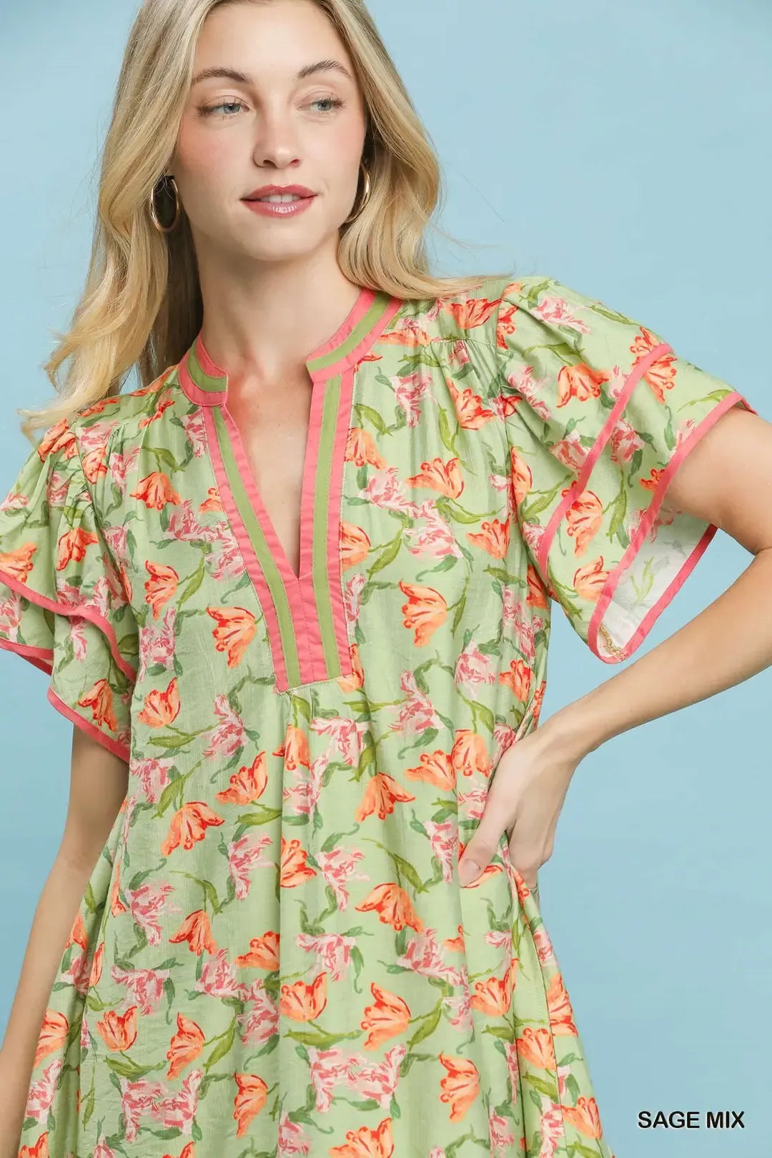 Umgee floral tiered dress with flutter sleeves in a sage mix, featuring a feminine and breezy summer style.