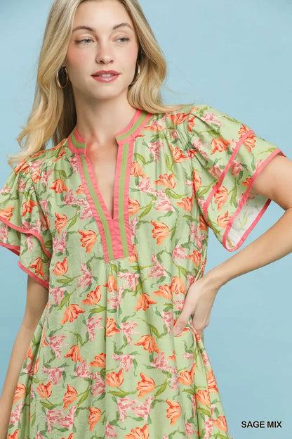 Umgee floral tiered dress with flutter sleeves in a sage mix, featuring a feminine and breezy summer style.