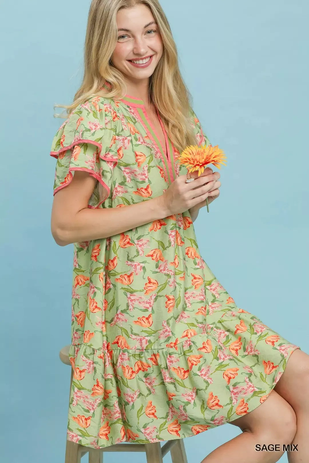 Umgee floral tiered dress with flutter sleeves in sage mix, featuring a feminine, flowing design perfect for casual or special occasions.