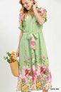 Sage green Umgee floral border print midi dress with a relaxed fit, featuring a mix of floral patterns and a midi length.