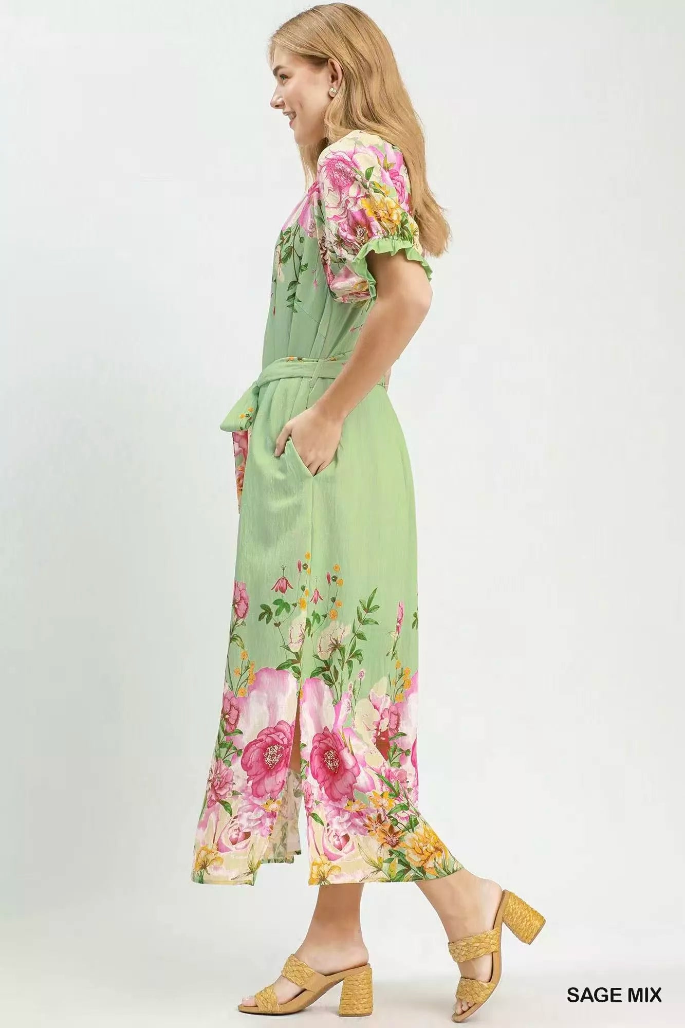 Sage green Umgee floral border print midi dress from Trendsi, featuring a flowy silhouette and feminine floral pattern.