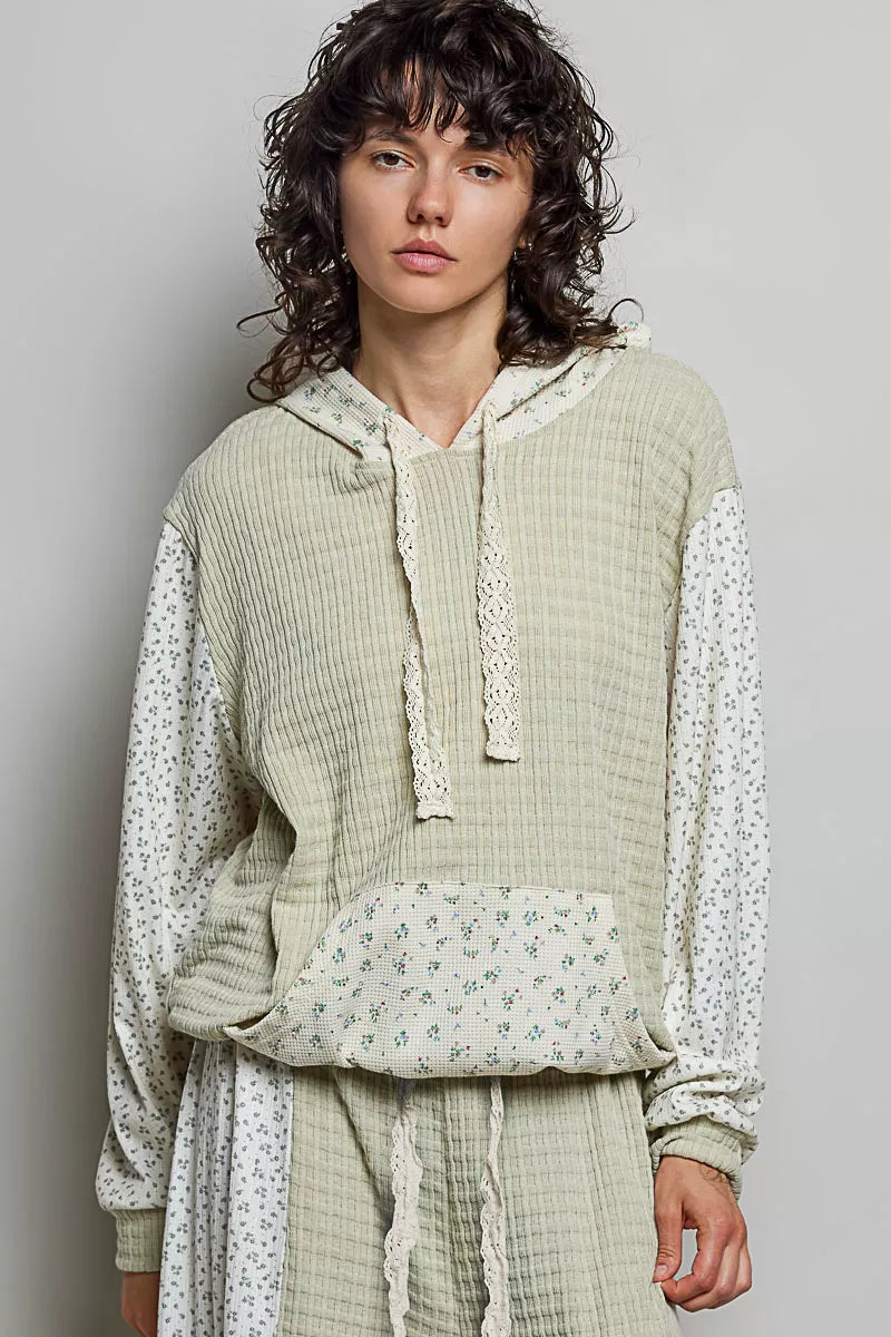 Trendsi POL mixed knit hoodie with contrast printed sleeves and kangaroo pocket, casual streetwear style in sage and multicolor.