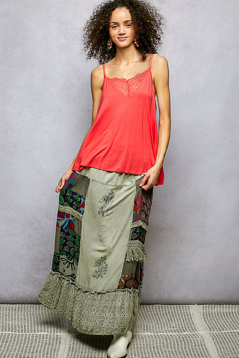 Multi-colored patchwork embroidered ruffled skirt from Trendsi, featuring intricate designs and a feminine, flowy silhouette.