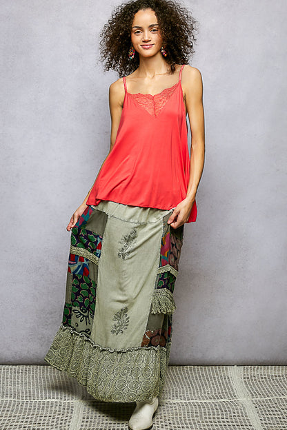 Multi-colored patchwork embroidered ruffled skirt from Trendsi, featuring intricate designs and a feminine, flowy silhouette.