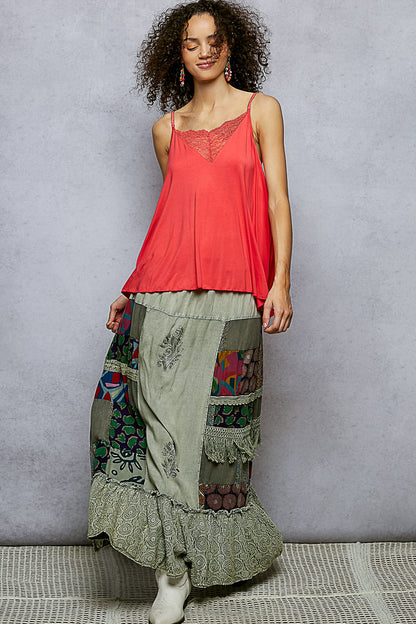 Multi-colored patchwork embroidered ruffled skirt by Trendsi, featuring a stylish design with intricate embroidery and layered ruffles.