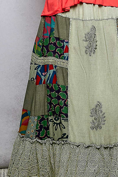 Colorful patchwork embroidered ruffled skirt from Trendsi featuring intricate patterns and a flowy, feminine design.