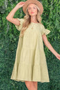 Sage green cotton gauze baby doll casual dress by And The Why from Trendsi, featuring a relaxed fit and lightweight fabric.