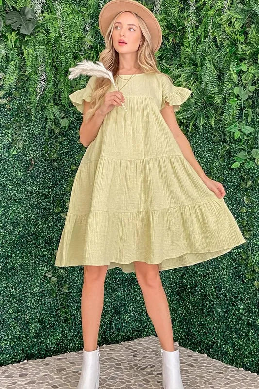 Cotton gauze baby doll casual dress by Trendsi, sage green color, featuring a relaxed fit and soft fabric for comfortable wear.