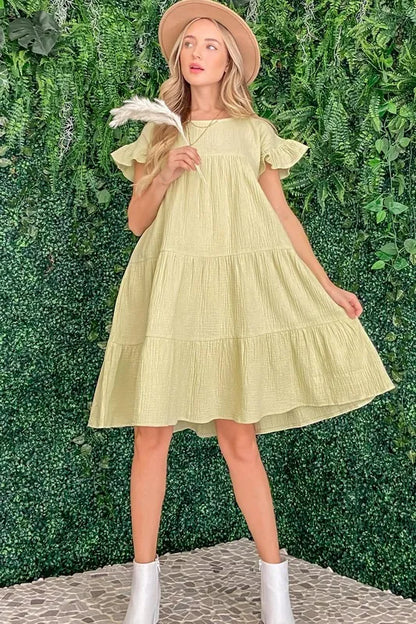 Cotton gauze baby doll casual dress by Trendsi, sage green color, featuring a relaxed fit and soft fabric for comfortable wear.