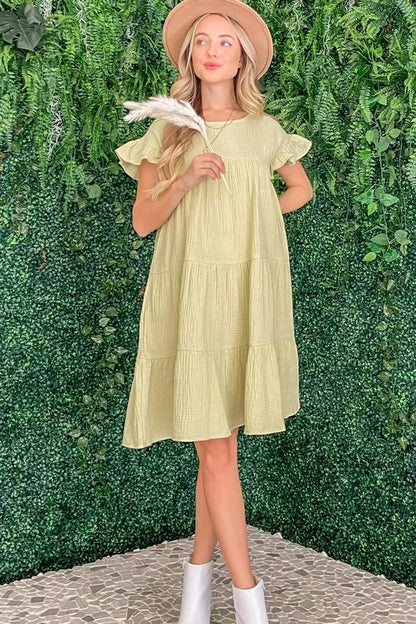 Light sage green cotton gauze baby doll casual dress by Trendsi, featuring a relaxed fit and soft, breathable fabric.