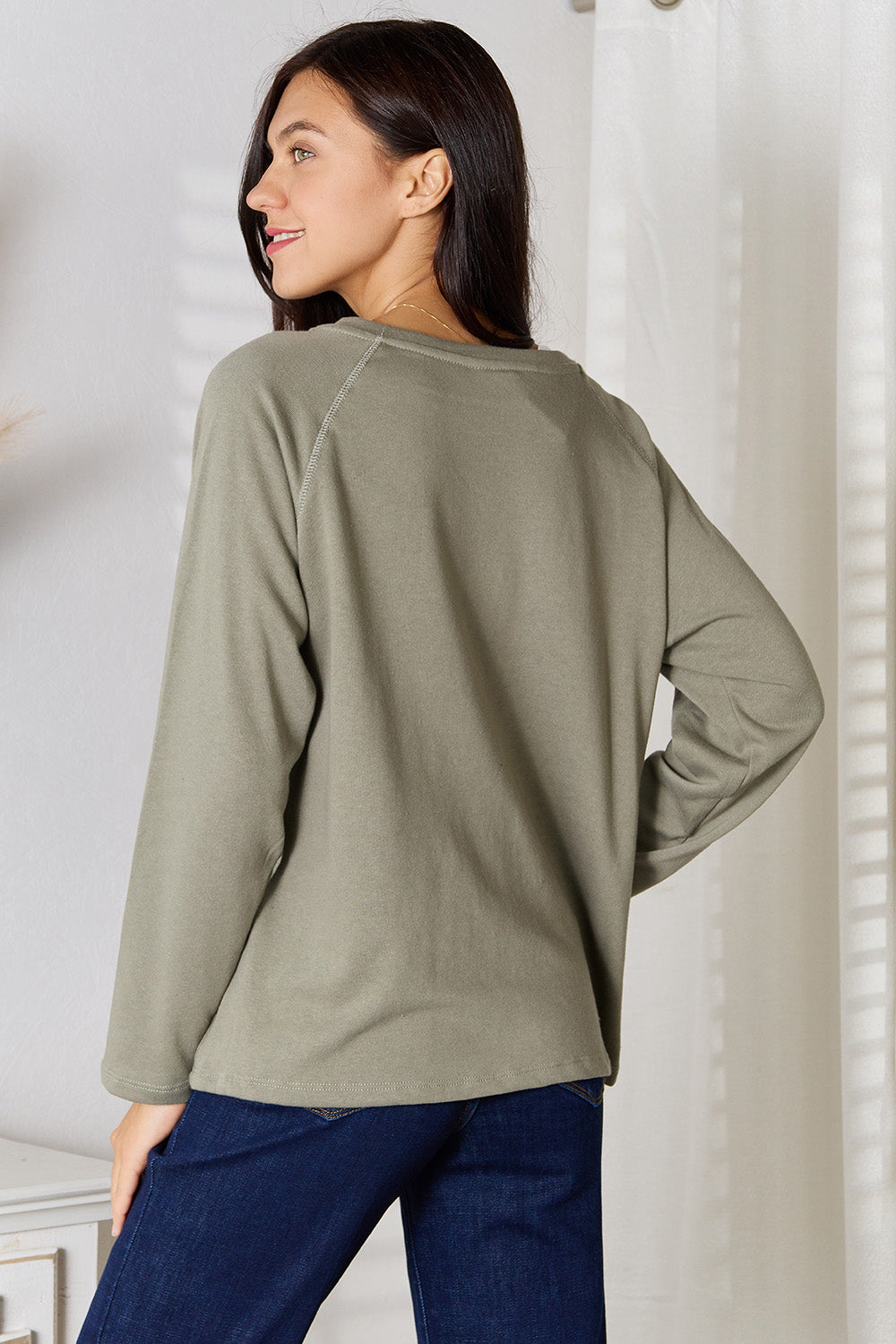 Sage green Culture Code full-size V-neck long sleeve T-shirt by Trendsi, soft fabric, casual style, displayed on a hanger.