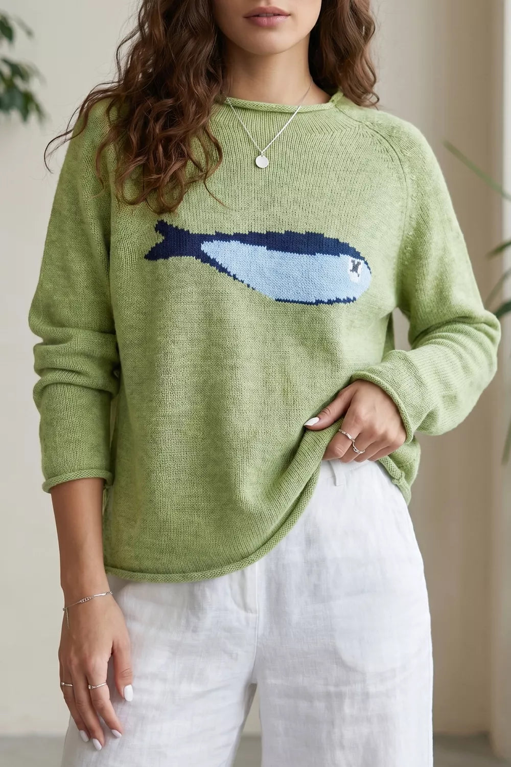 Sage green fish graphic round neck sweater by Trendsi, featuring a colorful aquatic fish design on soft knit fabric.