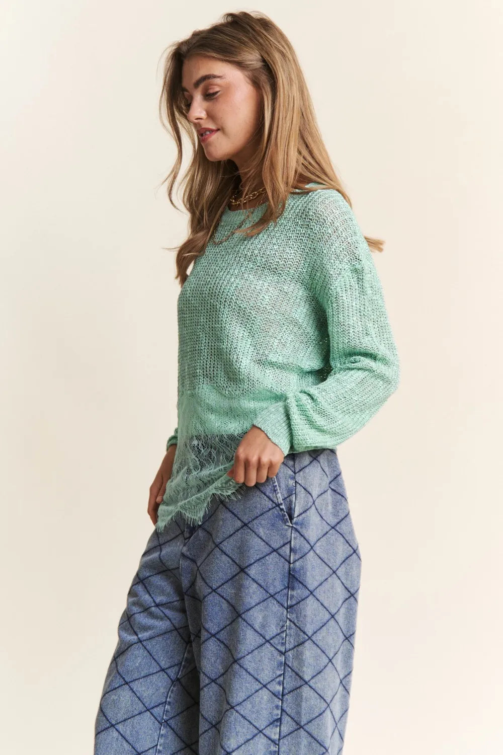 Sage green J.NNA lace detail long sleeve knit top by Trendsi, featuring intricate lace accents and a fitted knit design.