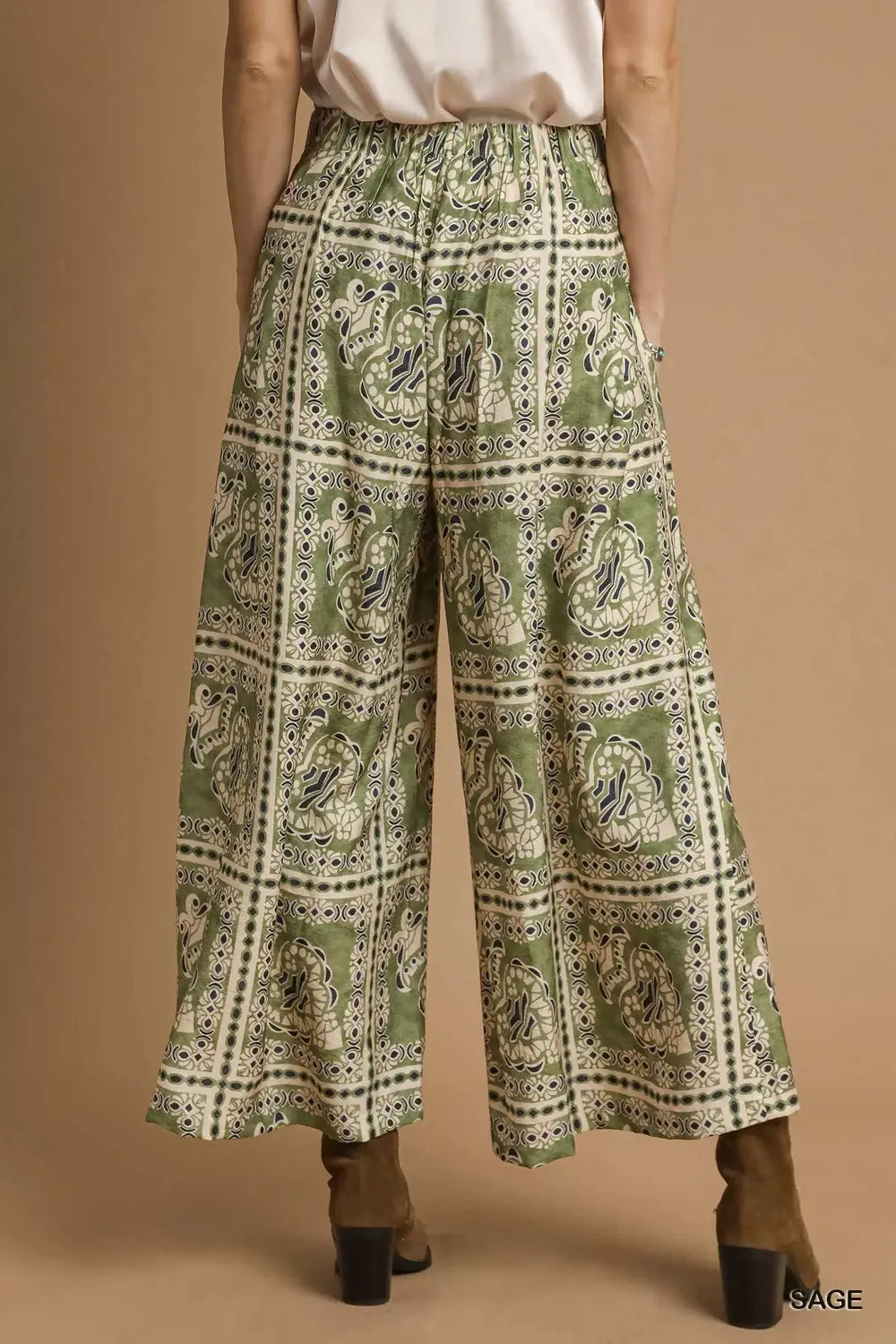 Umgee bohemian print pants with pockets, featuring a relaxed fit and vibrant patterns, styled for casual wear.