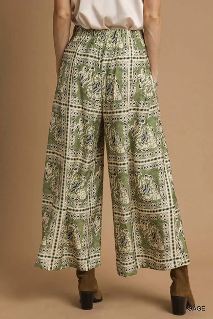 Umgee bohemian print pants with pockets, featuring a relaxed fit and vibrant patterns, styled for casual wear.