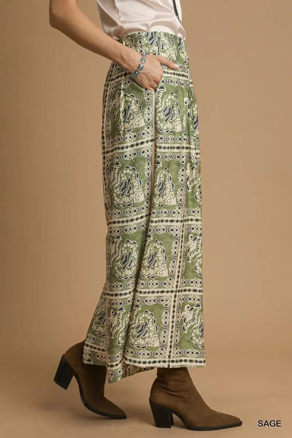 Umgee bohemian print pants with pockets, featuring a relaxed fit and earthy pattern, ideal for casual and boho styles.