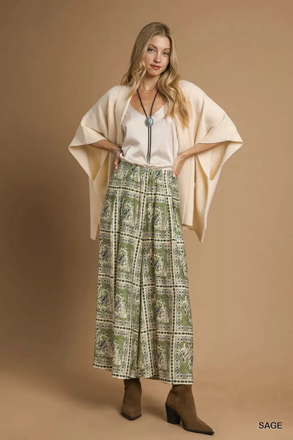 Umgee Bohemian print pants with pockets, sage-green color, featuring a relaxed fit and boho-inspired design.