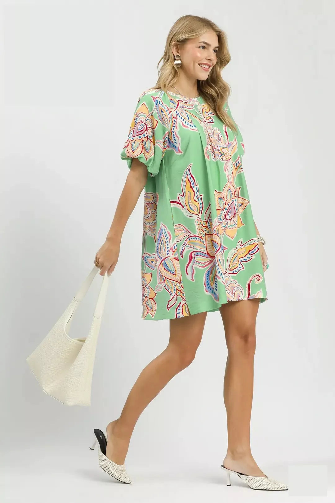 Umgee boho floral print mini dress with pockets, sage green color, sleeveless design, casual style, suitable for warm weather.