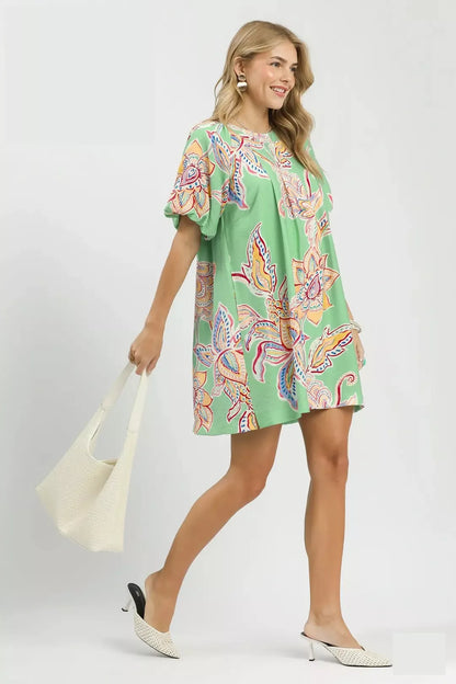Umgee boho floral print mini dress with pockets, sage green color, sleeveless design, casual style, suitable for warm weather.