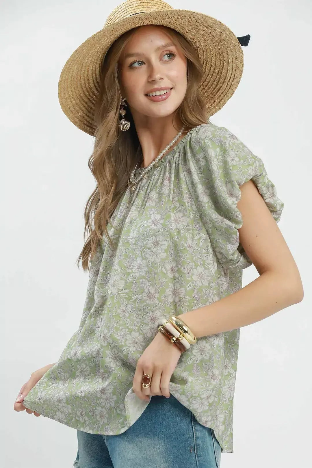 Sage green Umgee floral puff sleeve blouse by Trendsi, featuring a feminine design with ruffled sleeves and a flowy fit.
