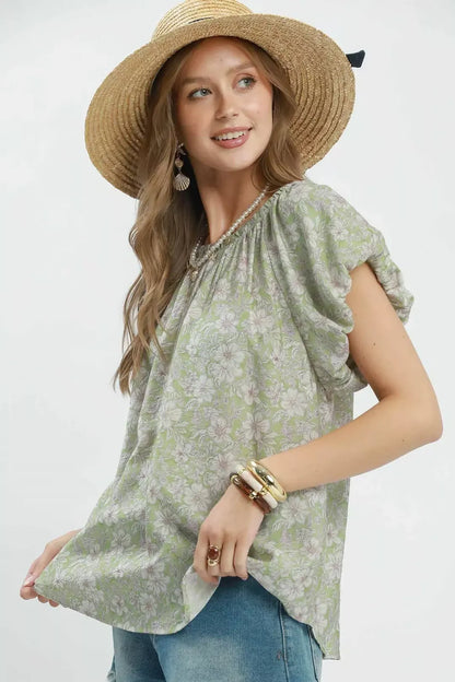 Sage green Umgee floral puff sleeve blouse by Trendsi, featuring a feminine design with ruffled sleeves and a flowy fit.
