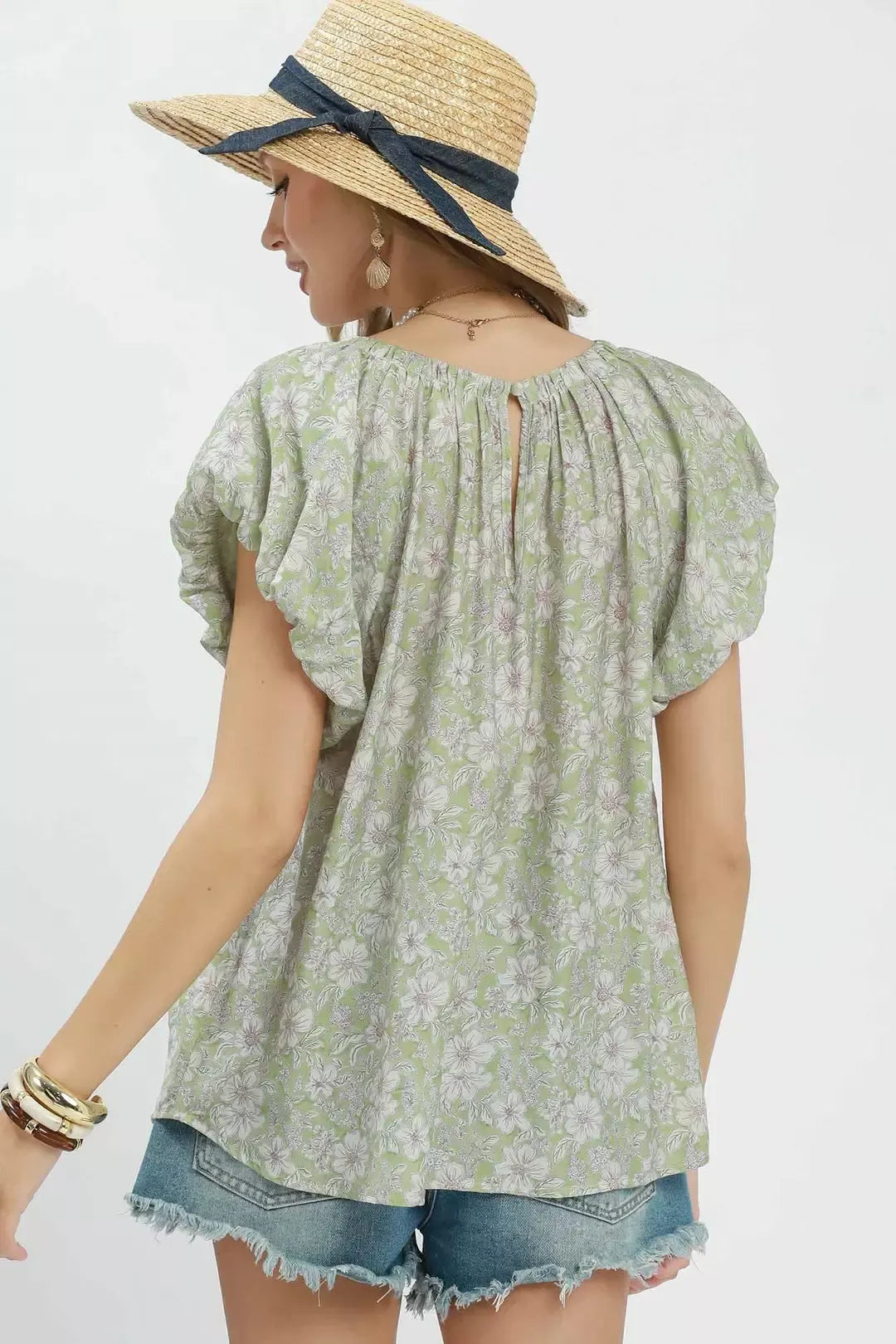 Sage green Umgee floral puff sleeve blouse with ruffled details, lightweight fabric, and a feminine, flowy silhouette.