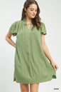 Sage green Umgee Flutter Sleeve V-Neck Shift Dress with relaxed fit and short flutter sleeves, styled for casual wear.