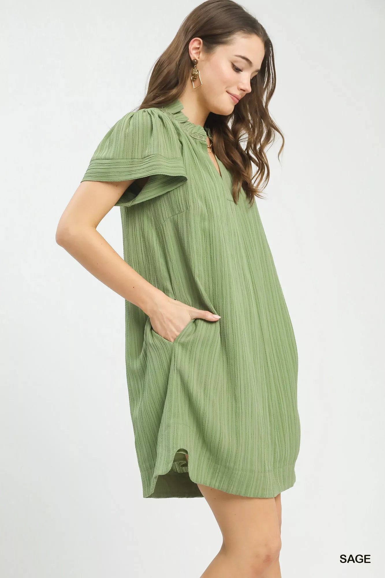Light sage green Umgee Flutter Sleeve V-Neck Shift Dress with relaxed fit, featuring flutter sleeves and a V-neck design.