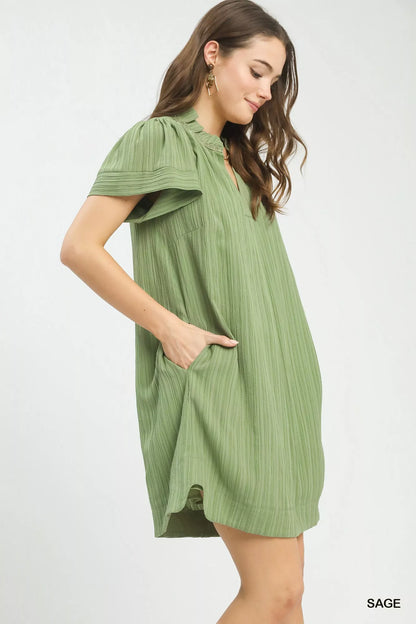 Light sage green Umgee Flutter Sleeve V-Neck Shift Dress with relaxed fit, featuring flutter sleeves and a V-neck design.