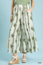 Sage green Umgee geometric boho print wide-leg pants with relaxed fit and flowy fabric, stylish for casual and bohemian looks.