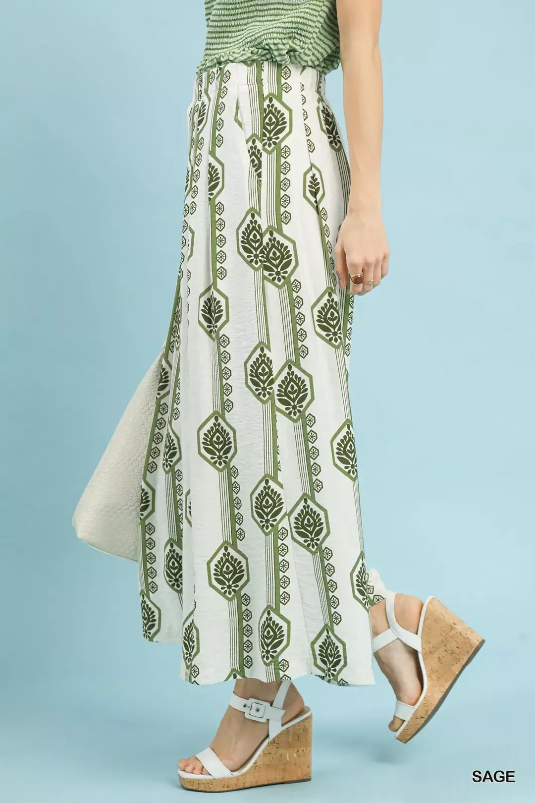 Sage green Umgee geometric boho print wide-leg pants with relaxed fit, featuring bold patterns and flowy fabric.