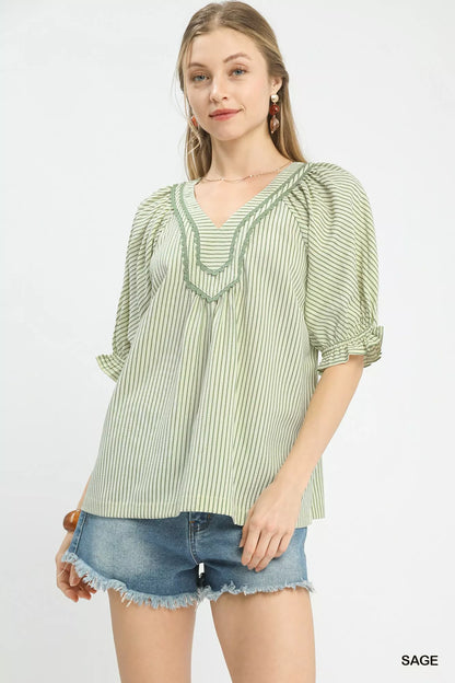 Sage green Umgee stripe V-neck blouse by Trendsi, featuring a relaxed fit and stylish V-neck design.