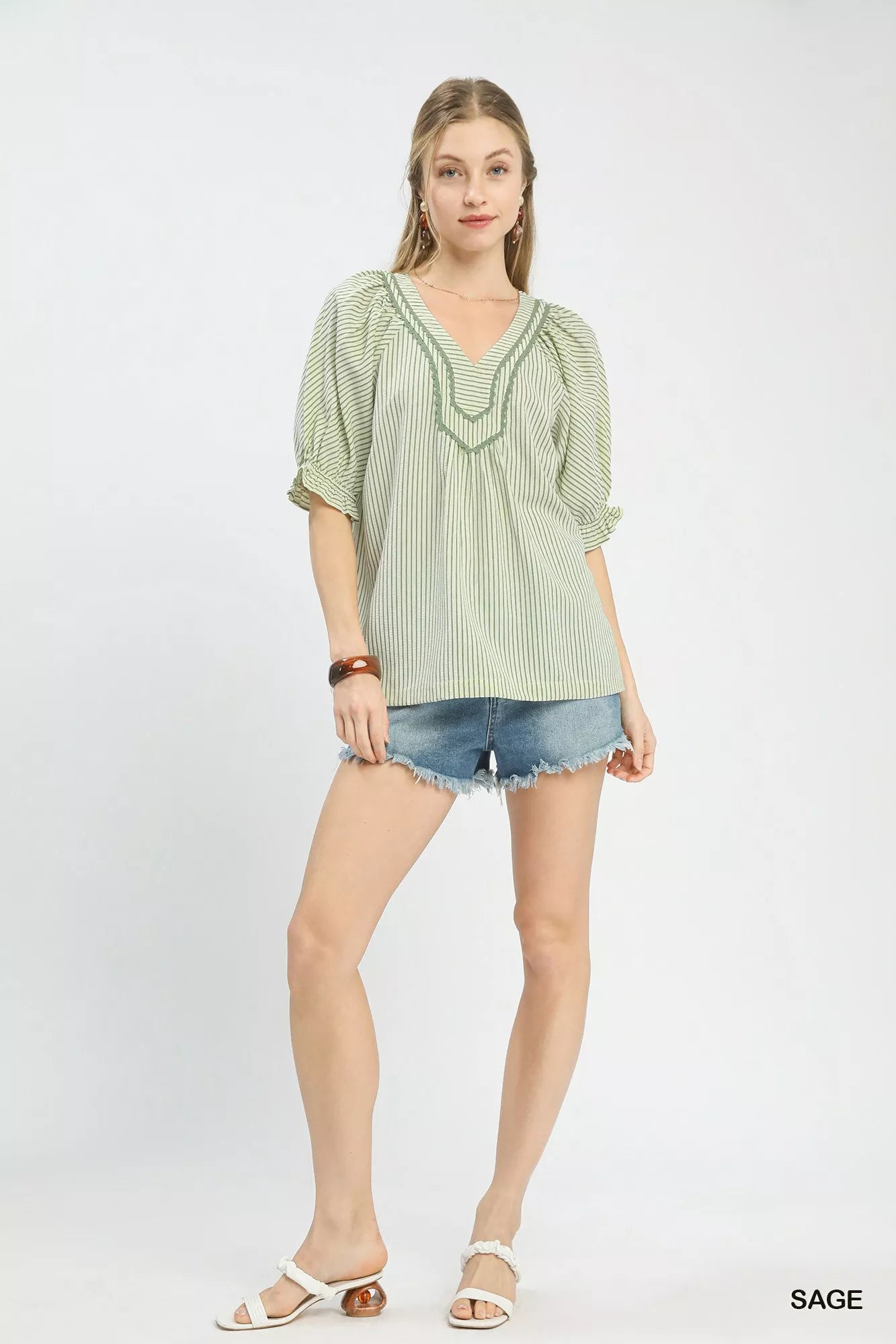 Sage green Umgee Stripe V-Neck Blouse with short sleeves and relaxed fit, styled with a casual, everyday look.