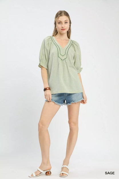 Sage green Umgee Stripe V-Neck Blouse with short sleeves and relaxed fit, styled with a casual, everyday look.